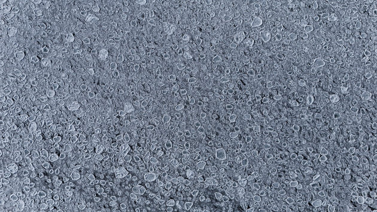 Detailed view of frozen bubbles on an icy surface capturing winter textures. — anti-slip epoxy coating